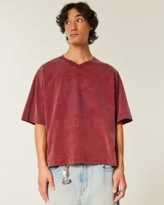 Camiseta de fútbol americano con estampado gráfico, oversize y corte corto.