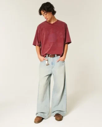 Camiseta de fútbol americano con estampado gráfico, oversize y corte corto.