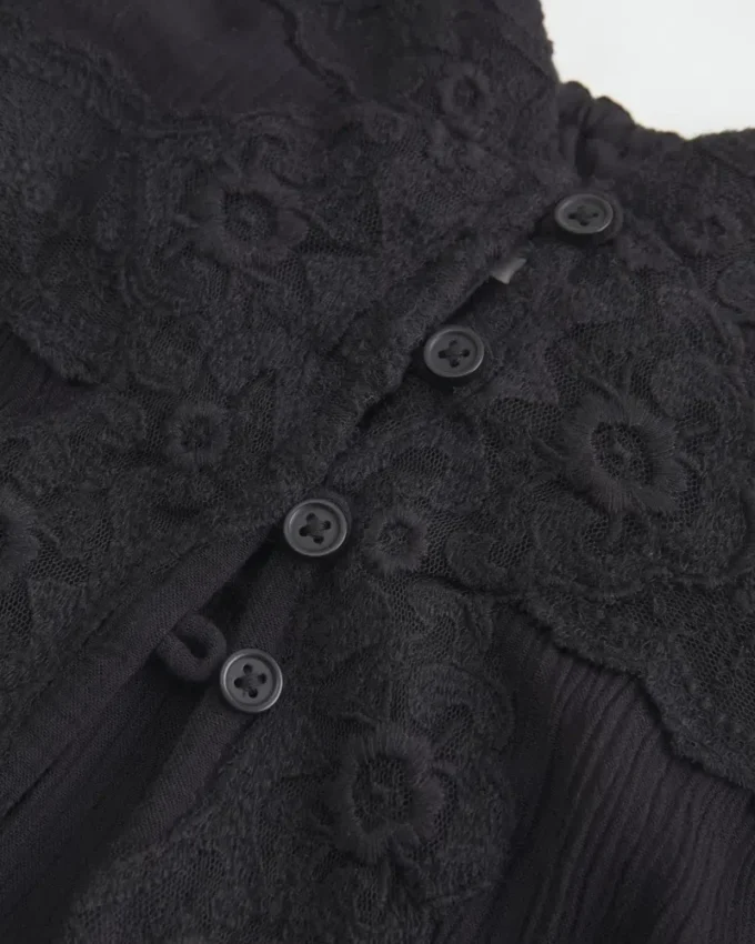 Camiseta larga con detalle de encaje Camiseta larga con detalle de encaje