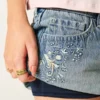 Falda pantalón micro mini de denim de talle ultra bajo Falda pantalón micro mini de denim de talle ultra bajo