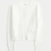 Hollister Cárdigan cómodo con bolsillos en forma de lazo Hollister Cárdigan cómodo con bolsillos en forma de lazo