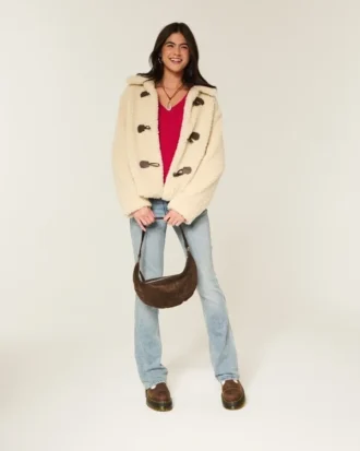 Jersey icónico de cuello en V con tejido de punto trenzado