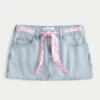 Mini falda pantalón vaquera con cintura baja y lazo Mini falda pantalón vaquera con cintura baja y lazo