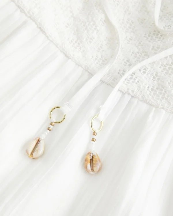 Minivestido babydoll con corpiño sin tirantes estilo croché Minivestido babydoll con corpiño sin tirantes estilo croché