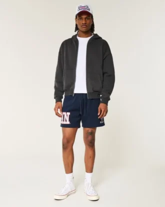 Pantalones cortos de felpa hasta la mitad del muslo con gráfico de los UConn Huskies