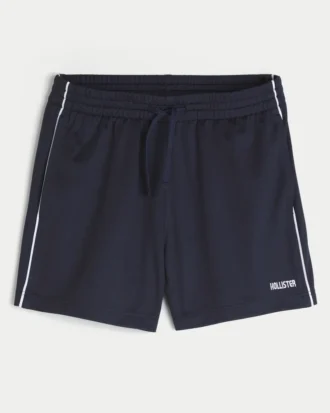 Pantalones cortos de fútbol de punto con logotipo hasta la mitad del muslo