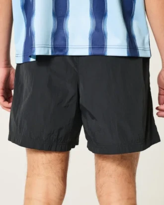 Pantalones cortos de fútbol hasta la mitad del muslo