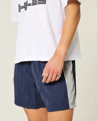 Pantalones cortos de fútbol holgados hasta la mitad del muslo