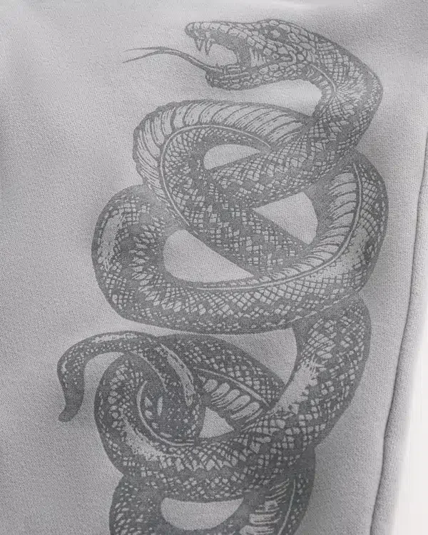 Pantalones de chándal holgados con estampado de doble serpiente Pantalones de chándal holgados con estampado de doble serpiente