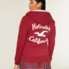 Sudadera con capucha, cremallera y logo gráfico, con forro de sherpa, de la colección Holiday Vault Sudadera con capucha, cremallera y logo gráfico, con forro de sherpa, de la colección Holiday Vault
