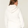 Sudadera con capucha, cremallera y logo gráfico, con forro de sherpa, de la colección Holiday Vault Sudadera con capucha, cremallera y logo gráfico, con forro de sherpa, de la colección Holiday Vault