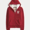 Sudadera con capucha, cremallera y logo gráfico, con forro de sherpa, de la colección Holiday Vault Sudadera con capucha, cremallera y logo gráfico, con forro de sherpa, de la colección Holiday Vault