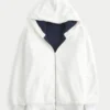 Sudadera con capucha reversible con forro de piel sintética y cremallera Sudadera con capucha reversible con forro de piel sintética y cremallera