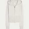 Sudadera con capucha y cremallera con dobladillo festoneado de Gilly Hicks