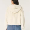 Sudadera con capucha y cremallera de pelo sintético Sudadera con capucha y cremallera de pelo sintético