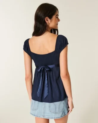 Top babydoll con lazo de satén