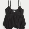 Top babydoll con tachuelas Top babydoll con tachuelas