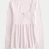 Top babydoll de manga larga con cuello Henley