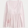 Top babydoll de manga larga con estampado gráfico en el pecho Top babydoll de manga larga con estampado gráfico en el pecho