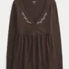 Top babydoll de manga larga con pinzas en el pecho