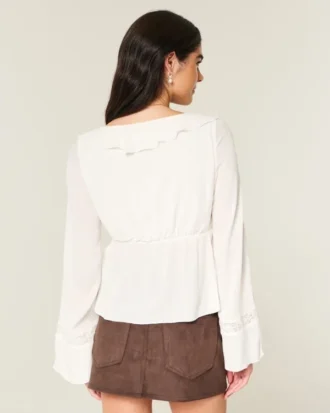 Top babydoll de manga larga con volantes