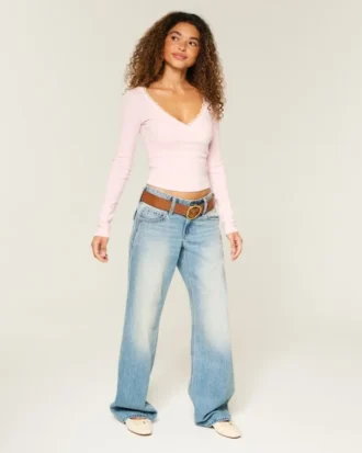 Top cruzado de manga larga con ribete de encaje