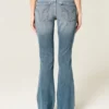 Vaqueros bootcut de talle bajo, lavado medio y efecto desgastado Vaqueros bootcut de talle bajo, lavado medio y efecto desgastado