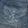 Vaqueros holgados de skater con estampado de águila en lavado medio