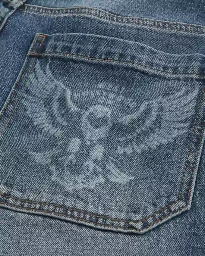 Vaqueros holgados de skater con estampado de águila en lavado medio