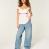 Vaqueros holgados de talle bajo y lavado medio con cintura ajustable Vaqueros holgados de talle bajo y lavado medio con cintura ajustable