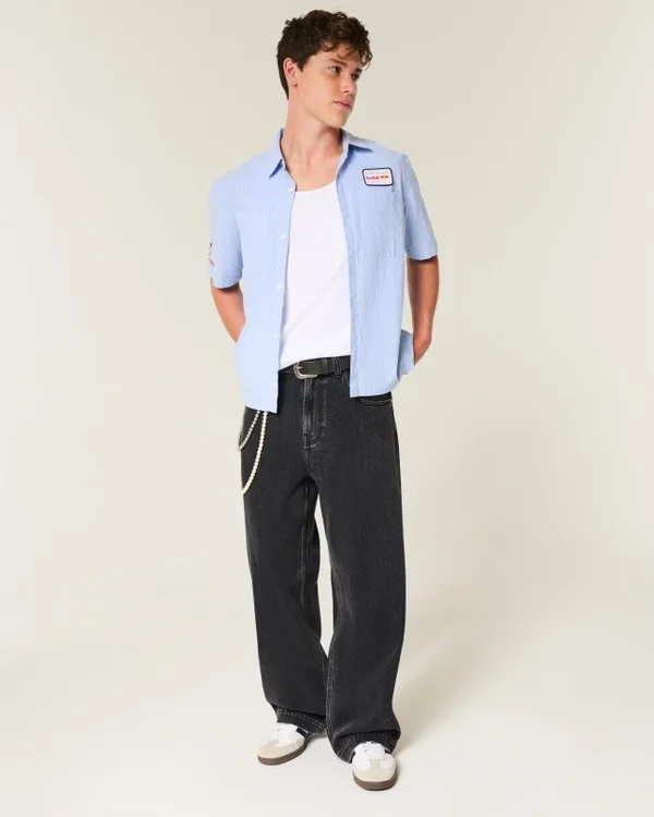 Vaqueros superbaggy con estampado de estrellas en negro lavado Vaqueros superbaggy con estampado de estrellas en negro lavado